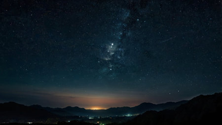 Milky way over the mountains at night. Long exposure photograph.