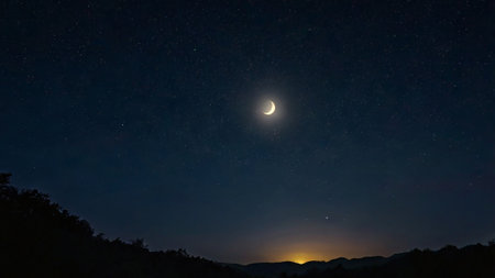 Night sky with stars and moon. Long exposure photograph of a starry night.の写真素材