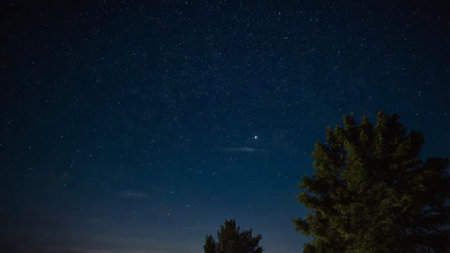 Night sky with stars and milky way. Long exposure photograph.