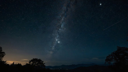 Milky Way over the mountains at night. Long exposure photograph.