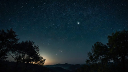 Milky Way over the mountains at night with starry sky.