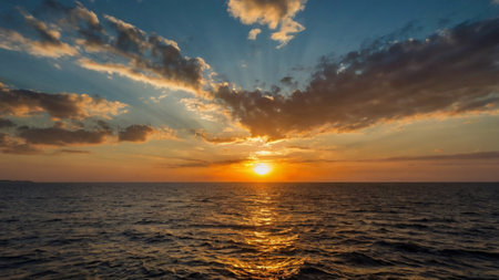 Beautiful sunset on the sea. The sun sets over the sea.の写真素材