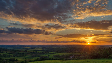 Sunset in the countryside. Beautiful sky with clouds at sunset.の写真素材
