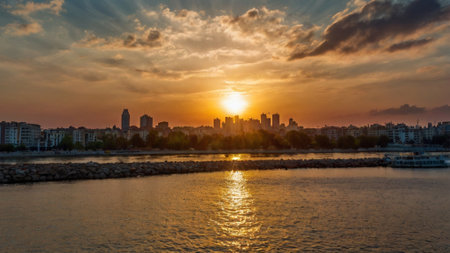 Beautiful sunset over the river and the cityscape of the cityの写真素材