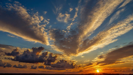 Dramatic sunset sky with clouds. Nature background. Panoramaの写真素材