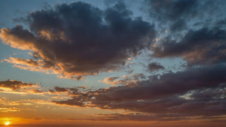 Cloudscape, Colored Clouds at Sunset near the Ocean on a Cloudy Day