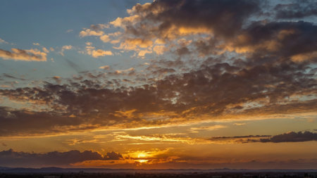 Cloudscape, Colored Clouds at Sunset near the Ocean over the Cityの写真素材