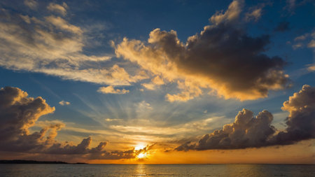 Beautiful sunset over the sea. Colorful sky with clouds at sunset.の写真素材