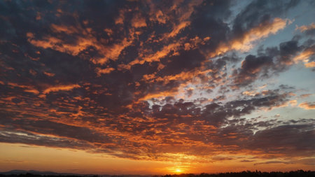 Sunset sky with clouds. Nature background. Sunset sky with clouds and sun