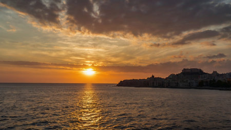 Beautiful sunset over the sea and the cityの写真素材