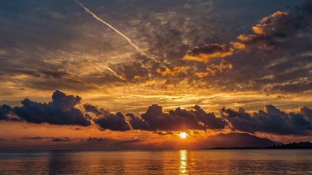 Beautiful sunset over the sea with clouds in the sky. Nature background