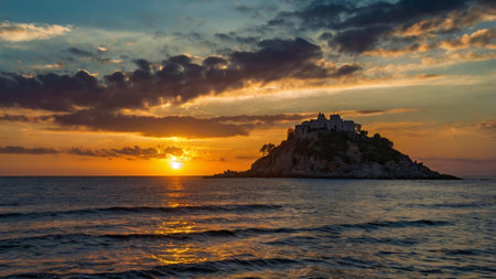 Sunset over the island in Budva, Montenegroの写真素材