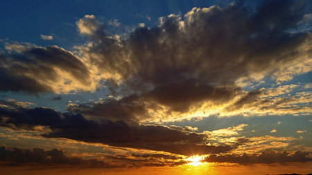 Beautiful sunset sky background. Dramatic sunset sky with clouds.の写真素材