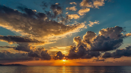 Sunset over the sea. Beautiful sky with clouds at sunset.の写真素材