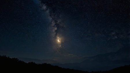 Night sky with stars and milky way. Milky way over mountains.