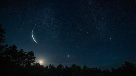 Night sky with stars and the moon. Long exposure photograph with grain
