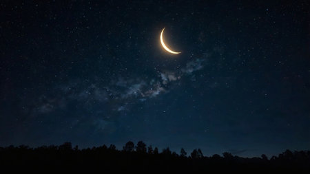 Crescent moon in the night sky with stars and milky wayの写真素材