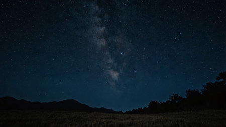 Milky Way over the mountain at night with starry sky.