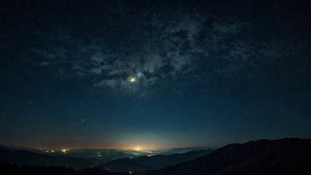 Night sky with stars and milky way over the mountain range.の写真素材