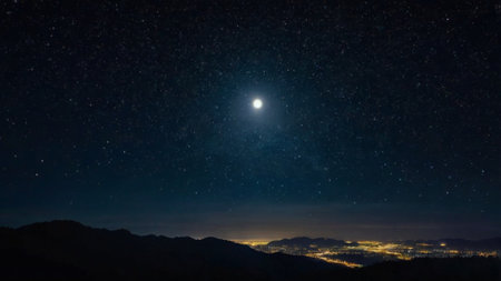 Night sky with stars and moon. Panoramic view of the mountains.の写真素材