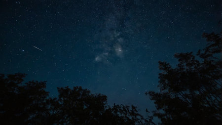 Night sky with stars and milky way. Long exposure photograph.