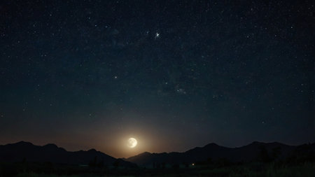 Night sky with full moon and stars. Milky way over mountains.