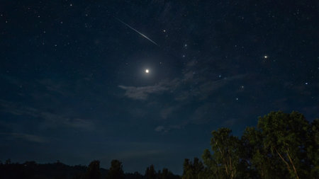 Night sky with stars and a milky way. Long exposure photograph.