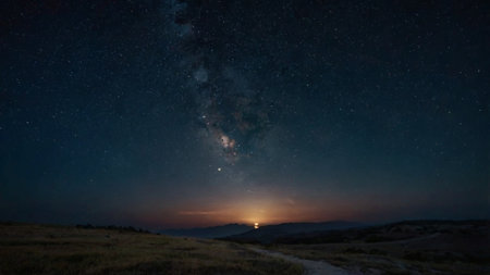 Milky Way over the mountains at sunset. Long exposure photo.の写真素材