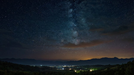 Milky Way over the village in the mountains. Long exposure.