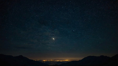 Night starry sky with milky way over the mountain range.