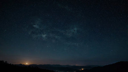Night sky with stars and milky way over the mountain range.の写真素材