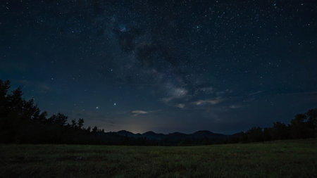Milky Way over the mountains in summer night. Starry sky.の写真素材