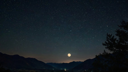 beautiful night sky with stars and milky way over the mountainsの写真素材
