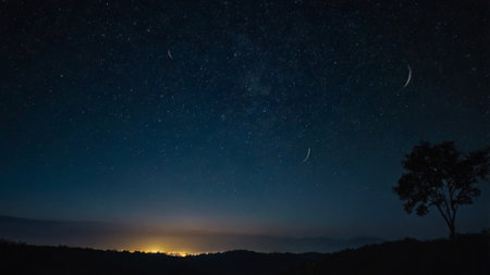 Night sky with stars and milky way over the mountains. Long exposure.