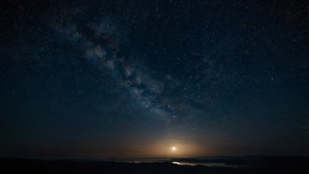 Milky way in the night sky with stars and clouds. Long exposure photograph.の写真素材