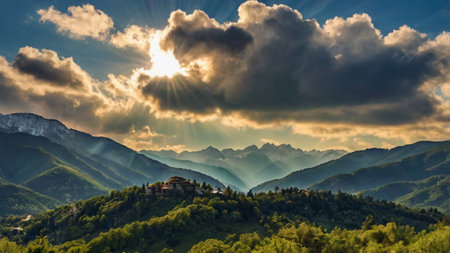 Sunset in the mountains with sun rays and clouds over the valleyの写真素材
