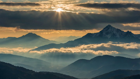 Sunset in the mountains. Landscape of mountains in the clouds.