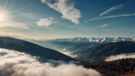 Mountain landscape with clouds and sun in the sky. Panoramic view.
