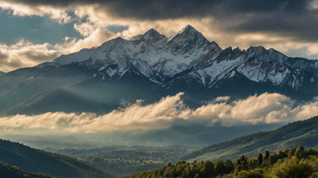 Sunset in the mountains. View of the snow-capped peaks.の写真素材