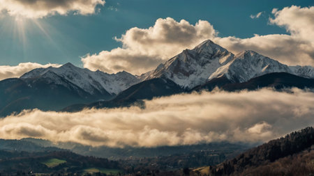 Panoramic view of the Alps with clouds and snow in the foreground