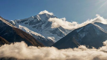 Mountain peak with clouds and blue sky