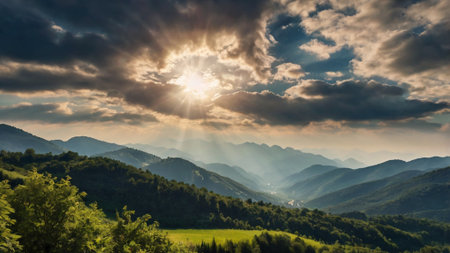 Beautiful sunset in the mountains. Summer landscape. The sun shines through the clouds.の写真素材