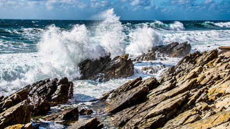 waves crashing on the rocks on the coast of the island of Sardinia