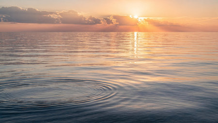 Beautiful sunset over the sea. The sun is reflected in the water.