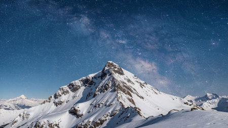 Beautiful starry night in the mountains. Winter landscape with stars and Milky way.