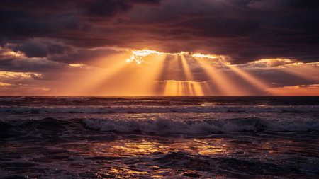 Beautiful sunset over the sea with clouds and rays of light.