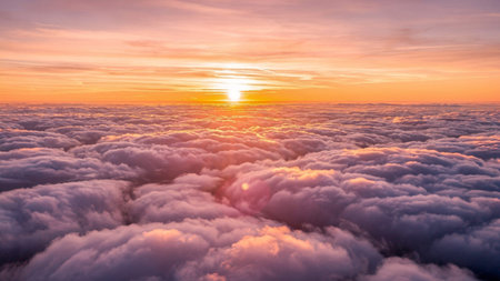 Beautiful sunrise above the clouds in the sky. Nature background.