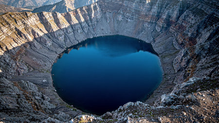 A breathtaking visual symphony of light and color across nature's most iconic and remote landscapes, featuring vivid aurora borealis reflected in frozen tundra lakes, dramatic double rainbows arching over emerald valleys after tropical rain, magical golden sunrises painting calm ocean surfaces in shades of amber and rose, and towering ancient sandstone canyons glowing deep orange under the last light of day.