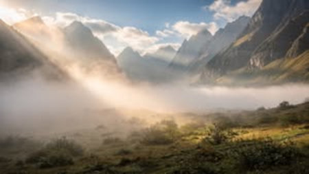 Foggy morning in the mountains. Landscape of foggy valley.