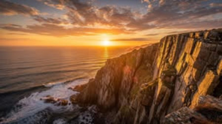 Aerial view of the Atlantic Ocean Coast during a colorful sunset. Taken in Cabo da Roca, Portugal.